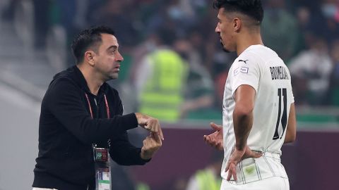 Xavi y Baghdad Bounedjah