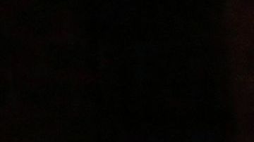 Oxford High students stand holding candles during a vigil after a shooting at Oxford High School at Lake Pointe Community Church in Lake Orion, Michigan on November 30, 2021. - A 15-year-old student opened fire at his Michigan high school on November 30, killing three teenagers and wounding eight other people before surrendering to police, authorities said, in what was the deadliest US school shooting so far this year. (Photo by JEFF KOWALSKY / AFP) (Photo by JEFF KOWALSKY/AFP via Getty Images)