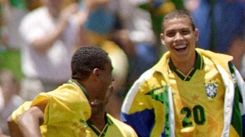 Brazilian forward Romario runs towards his teammat
