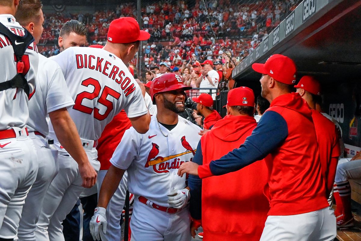ST LOUIS, MO - APRIL 11: Albert Pujols #5 of the St. Louis Cardinals is congratulated by teammates after hitting a solo home run against the Kansas City Royals during the first inning at Busch Stadium on April 11, 2022 in St Louis, Missouri. (Photo by Joe Puetz/Getty Images)
