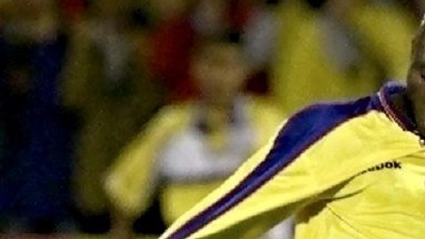 Freddy Rincon (L) of Colombia kicks the ball in fr