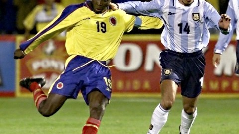 Freddy Rincon (L) of Colombia kicks the ball in fr