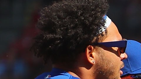 Jugadores de Mets y Cardinals durante la vaciada de bancas en el encuentro de este 27 de abril.