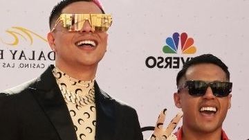 Grupo Firme y Harry Styles.