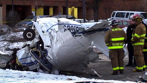 A Cessna 172 lies crumpled in a street in Zion, Il