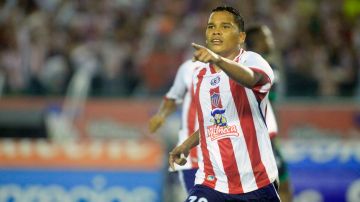 Junior's Carlos Bacca celebrates after s
