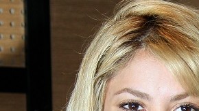 Colombian singer Shakira (L) poses with