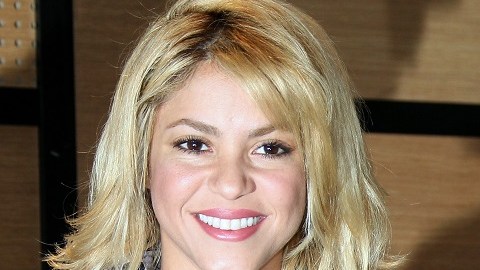 Colombian singer Shakira (L) poses with
