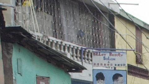 people walk to an open market in the rai