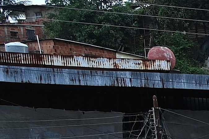 TOPSHOT - Rescuers and residents search through the rubble of destroyed houses for victims or survivors of a landslide during heavy rains in Las Tejerias, Aragua state, Venezuela, on October 9, 2022. - A landslide in central Venezuela left at least 22 people dead and more than 50 missing after heavy rains caused a river to overflow, Vice President Delcy Rodriguez said Sunday. (Photo by YURI CORTEZ / AFP) (Photo by YURI CORTEZ/AFP via Getty Images)
