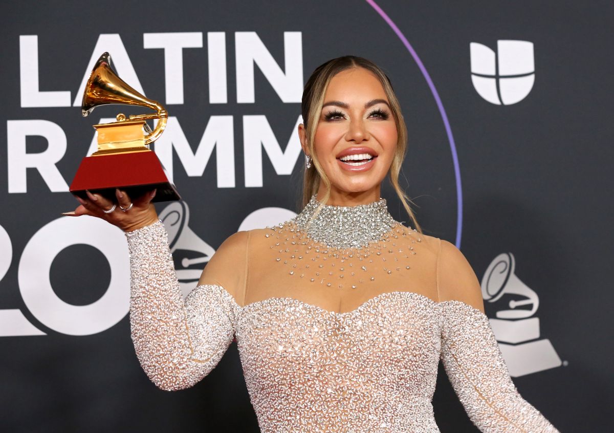 Chiquis Rivera wears a daring black jumpsuit full of openings that show her voluptuous ‘boobies’ when dancing