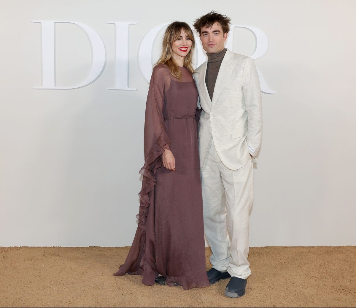 Robert Pattinson and Suki Waterhouse pose together for the first time on a red carpet