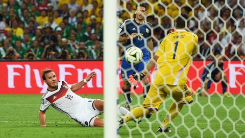 RIO DE JANEIRO, BRAZIL - JULY 13:  Mario Goetze of Germany scores his team's first goal past Sergio Romero of Argentina in extra time during the 2014 FIFA World Cup Brazil Final match between Germany and Argentina at Maracana on July 13, 2014 in Rio de Janeiro, Brazil.  (Photo by Laurence Griffiths/Getty Images)