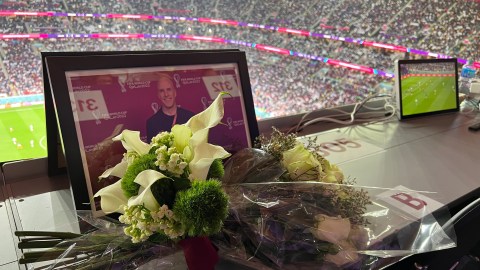 Flowers to remember Grant Wahl in the seat he was assigned for the France - England game at Al Bayt stadium.