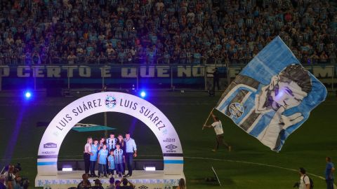 Uruguayan forward Luis Suarez (C) poses for a picture with his family during his official presentation at the Arena do Gremio Stadium in Porto Alegre, Brazil, on January 4, 2023. - Uruguayan international striker Luis Suarez has signed a two-year contract with Brazilian club Gremio. (Photo by SILVIO AVILA / AFP) (Photo by SILVIO AVILA/AFP via Getty Images)