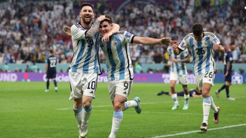 LUSAIL CITY, QATAR - DECEMBER 13: Julian Alvarez of Argentina celebrates with teammate Lionel Messi after scoring their side's second goal during the FIFA World Cup Qatar 2022 semi final match between Argentina and Croatia at Lusail Stadium on December 13, 2022 in Lusail City, Qatar. (Photo by Richard Heathcote/Getty Images)