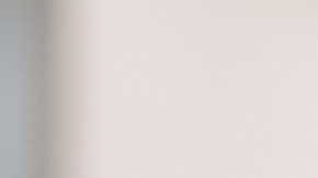 Bored,Executive,Woman,With,Laptop,Looking,At,Camera,Sitting,On