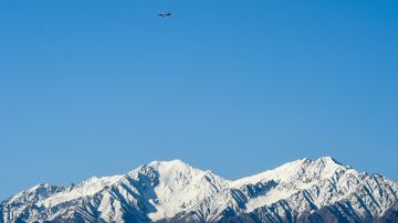 An Indian Air Force aircraft flies over a mountain range as seen from Leh, the joint capital of the union territory of Ladakh, on June 22, 2020. - India's Prime Minister Narendra Modi said June 20 that his country was "hurt and angry" after a border clash with China that left 20 troops dead, and warned that the army has been given free reign to respond to any new violence. (Photo by Tauseef MUSTAFA / AFP) (Photo by TAUSEEF MUSTAFA/AFP via Getty Images)