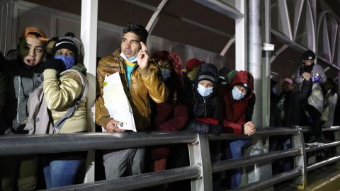 Cuban migrants block the Paso del Norte-Santa Fe international bridge between Mexico and the United States, to demand that the government of Donald Trump allows them to wait for their asylum process in US soil, in Ciudad Juarez, Chihuahua State, Mexico, on December 29, 2020. - The United States has sent at least 60,000 migrants to Mexican territory, most of them from Central America and other Latin American countries, under the "Remain in Mexico" program imposed by the Trump Administration. The program allows the US to send asylum-seekers back to Mexico while their cases are processed. (Photo by Herika MARTINEZ / AFP) (Photo by HERIKA MARTINEZ/AFP via Getty Images)