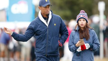Tiger Woods (I) junto a su ex novia Erica Herman (D).