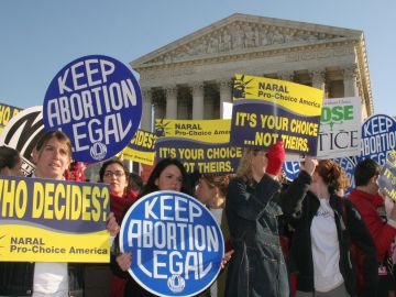 Pro-choice demonstrators wave signs in f