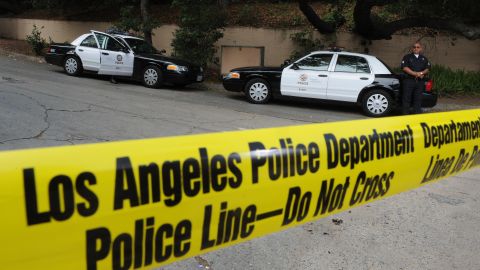 Police stand guard outside the rented Ho