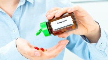 Omeprazole,Woman,Hand,Holding,On,Open,Palm,With,Pill,Tablets