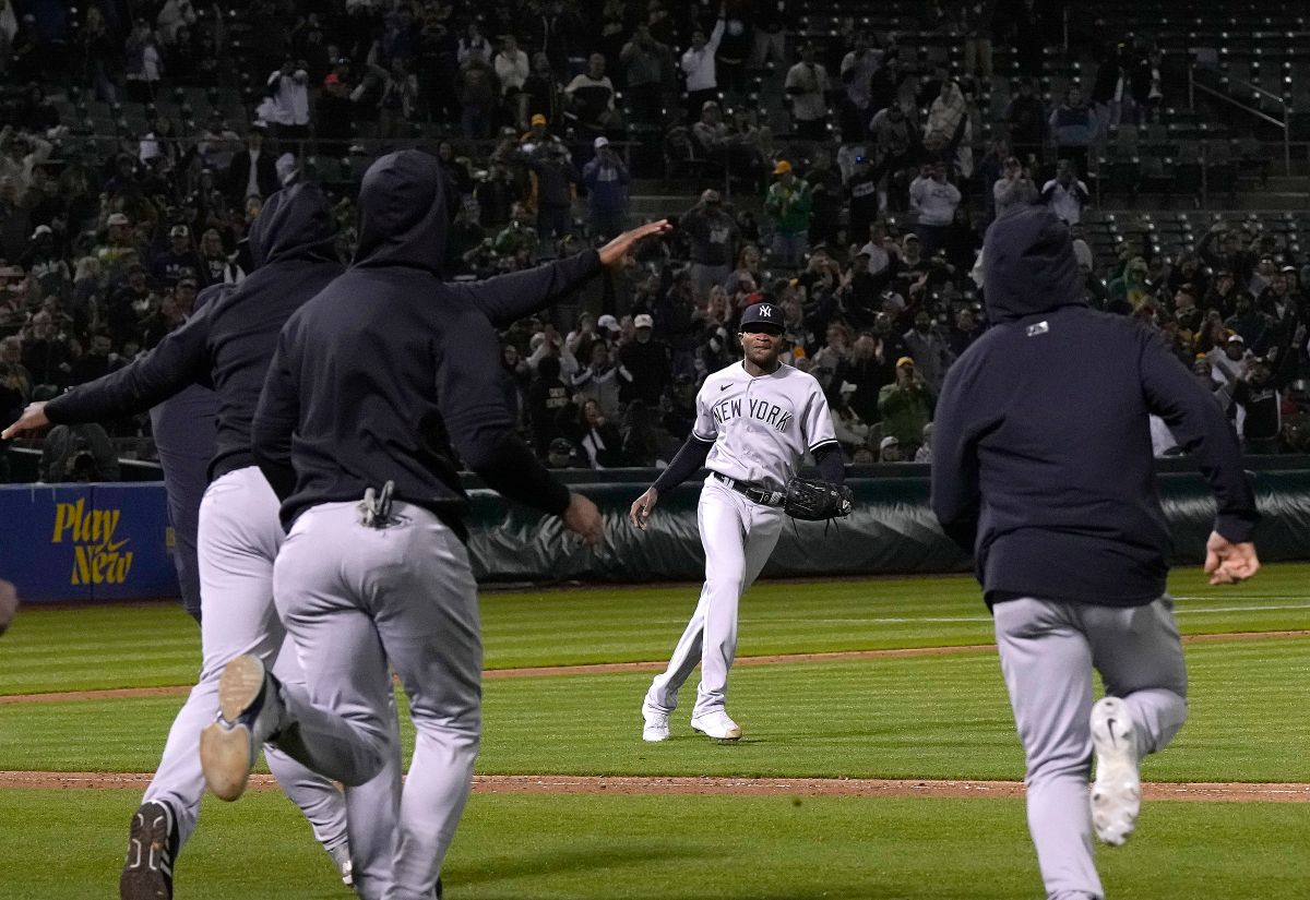 OAKLAND, CALIFORNIA - JUNE 28: Domingo German #0 of the New York Yankees celebrates his no-hit perfect game against the Oakland Athletics, defeating them 11-0 at RingCentral Coliseum on June 28, 2023 in Oakland, California. (Photo by Thearon W. Henderson/Getty Images)