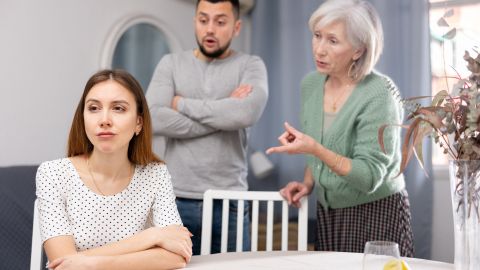 Woman,Ignoring,Her,Husband,And,Mother-in-law,Standing,Behind,And,Arguing