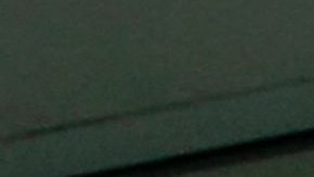 Una imagen del narcotraficante colombiano Dairo Antonio Usuga, también conocido como Otoniel, se muestra en una pantalla mientras el fiscal del Distrito Este de Nueva York, Breon Peace, habla sobre su extradición  el 5 de mayo de 2022.