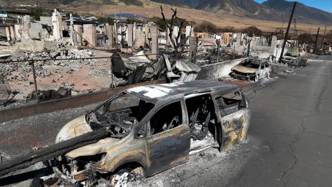 LAHAINA, HAWAII - AUGUST 17: In an aerial view, burned cars and homes are seen a neighborhood that was destroyed by a wildfire on August 17, 2023 in Lahaina, Hawaii. At least 111 people were killed and thousands were displaced after a wind driven wildfire devastated the towns of Lahaina and Kula early last week. Crews are continuing to search for missing people. (Photo by Justin Sullivan/Getty Images)