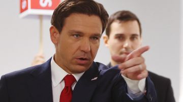 Florida Governor Ron DeSantis gestures as he speaks in the Spin Room following the first Republican Presidential primary debate at the Fiserv Forum in Milwaukee, Wisconsin, on August 23, 2023. (Photo by Alex Wroblewski / AFP) (Photo by ALEX WROBLEWSKI/AFP via Getty Images)