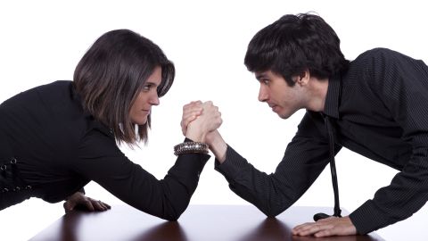 Men,And,Woman,In,A,Arm,Wrestling,At,The,Office