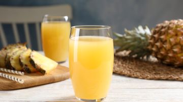 Delicious,Pineapple,Juice,In,Glass,On,White,Wooden,Table