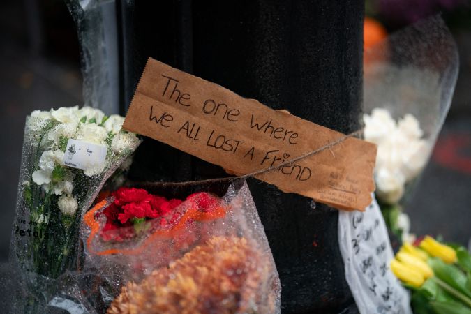 Floral tributes are left for actor Matthew Perry outside the apartment building which was used as the exterior shot in the TV show "Friends" in New York on October 29, 2023. Perry, 54, was known globally for his portrayal of wise-cracking character Chandler Bing on the wildly popular "Friends," which ran for 10 seasons from 1994 to 2004. First responders found Perry unconscious in a hot tub at his house on October 28 and were unable to revive him, law enforcement sources told the Los Angeles Times. Police confirmed they'd mounted a "death investigation for a male in his 50s." (Photo by Adam GRAY / AFP) (Photo by ADAM GRAY/AFP via Getty Images)