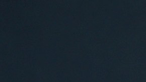 Meghan Markle posando en una alfombra roja en un evento.