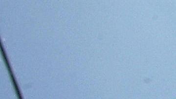 A Palestinian youth, his hands chained i