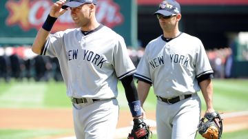 Derek Jeter (L) y Jorge Posada (R) compartieron 17 años como jugadores de New York Yankees.