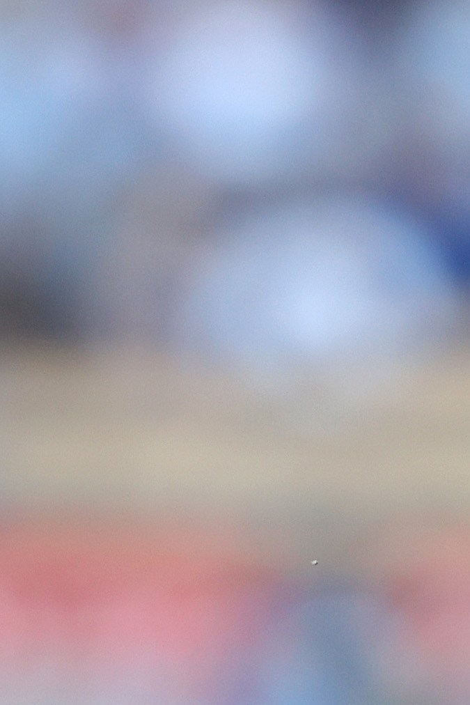 Peso Pluma participando en un evento deportivo.