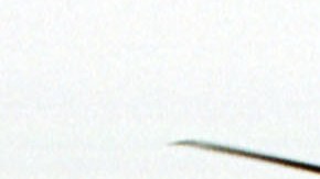 As Thick Gray Clouds Hang Overhead The Air An Hs 60 Seahawk Flies Around The USS Anzio As The U S F