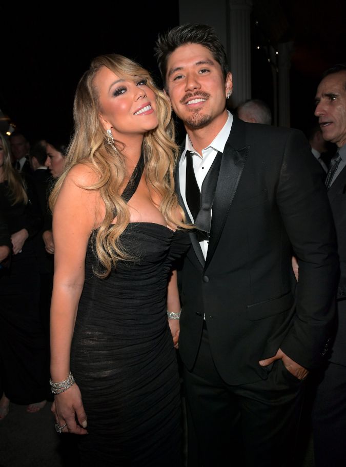 Mariah Carey y Bryan Tanaka posando juntos.