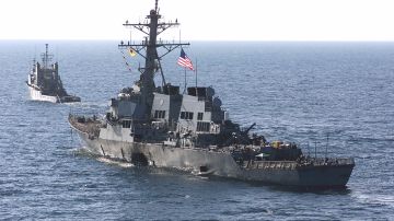 U.S. Navy destroyer USS Cole is towed back to U.S.