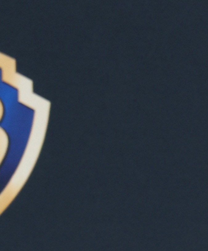 Ryan Gosling posando en una alfombra roja.