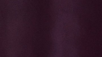 Shakira posando en una alfombra roja.