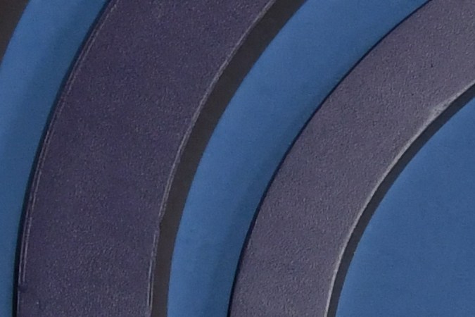 Elenco de Oppenheimer posando en una alfombra roja.