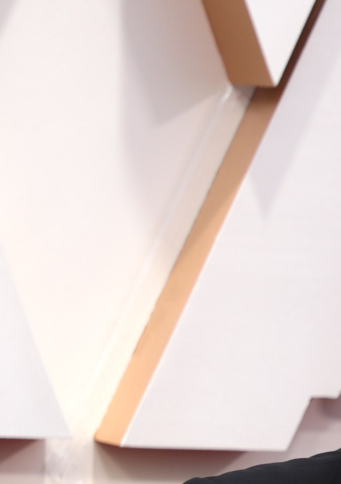 Quentin Tarantino posando en una alfombra roja.