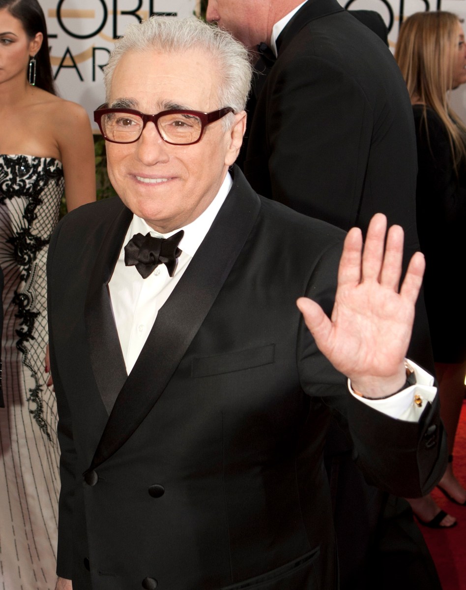 Martin Scorsese posando en una alfombra roja.