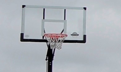 A Suffolk County Police car is stationed in the driveway of the home of Shoreham-Wading River High School junior Tom Cutinella, Thursday, Oct. 2, 2014, in Shoreham, N.Y. Authorities say Cutinella, a 16-year-old football player at the high school, died at a hospital the night before after suffering a head injury in an on-field collision during a game with John Glenn High School in Elwood, N.Y. (AP Photo/Kathy Kmonicek)