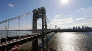 FILE - In this Sept. 8, 2014 file photo, the George Washington Bridge spans the Hudson River between Fort Lee, N.J., and New York, rear. "Time for some traffic problems in Fort Lee," spoken in January by Bridget Anne Kelly, aide to New Jersey Governor Chris Christie, was chosen as one of the most notable quotes of the year in an annual list released Tuesday, Dec. 9, 2014, by a Yale University librarian. (AP Photo/Mel Evans, File)