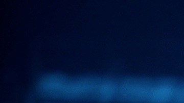 Peso Pluma y Anitta actuando en un show.